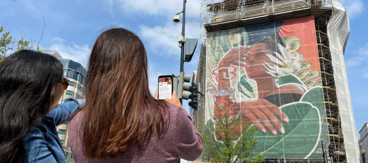 two women looking at building