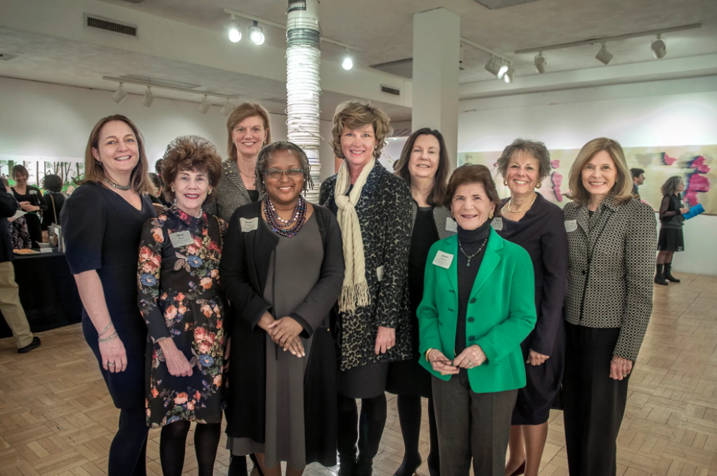 group of 9 women posing